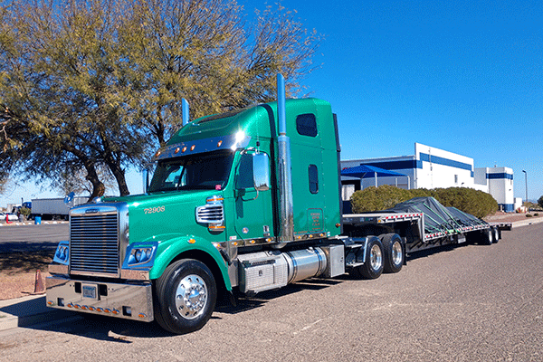 step-deck-trailer-tarped-freight-on-back